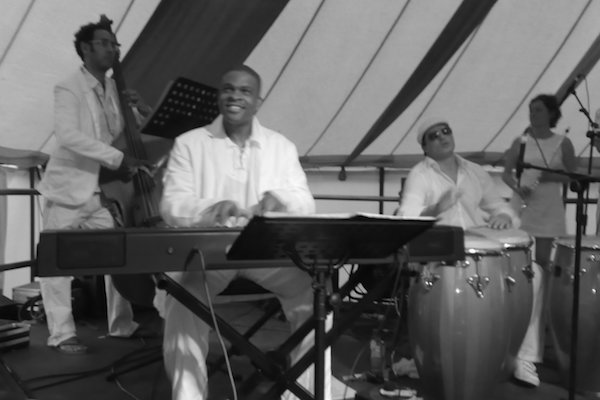 Tony Briscoe with Orquesta Montpelier Salsa Band performance at Glastonbury Festival, UK